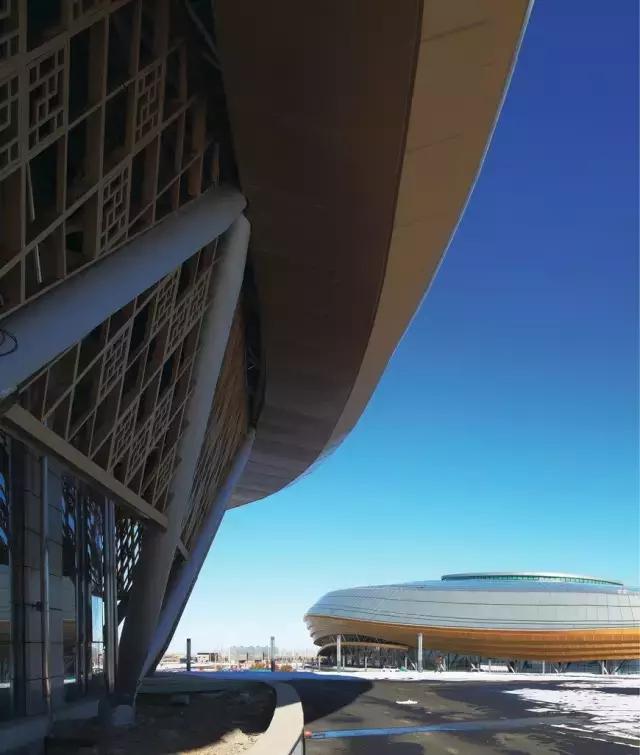 梅洪元丝路花谷孕育寒地建筑第十三届全国冬季运动会冰上运动中心