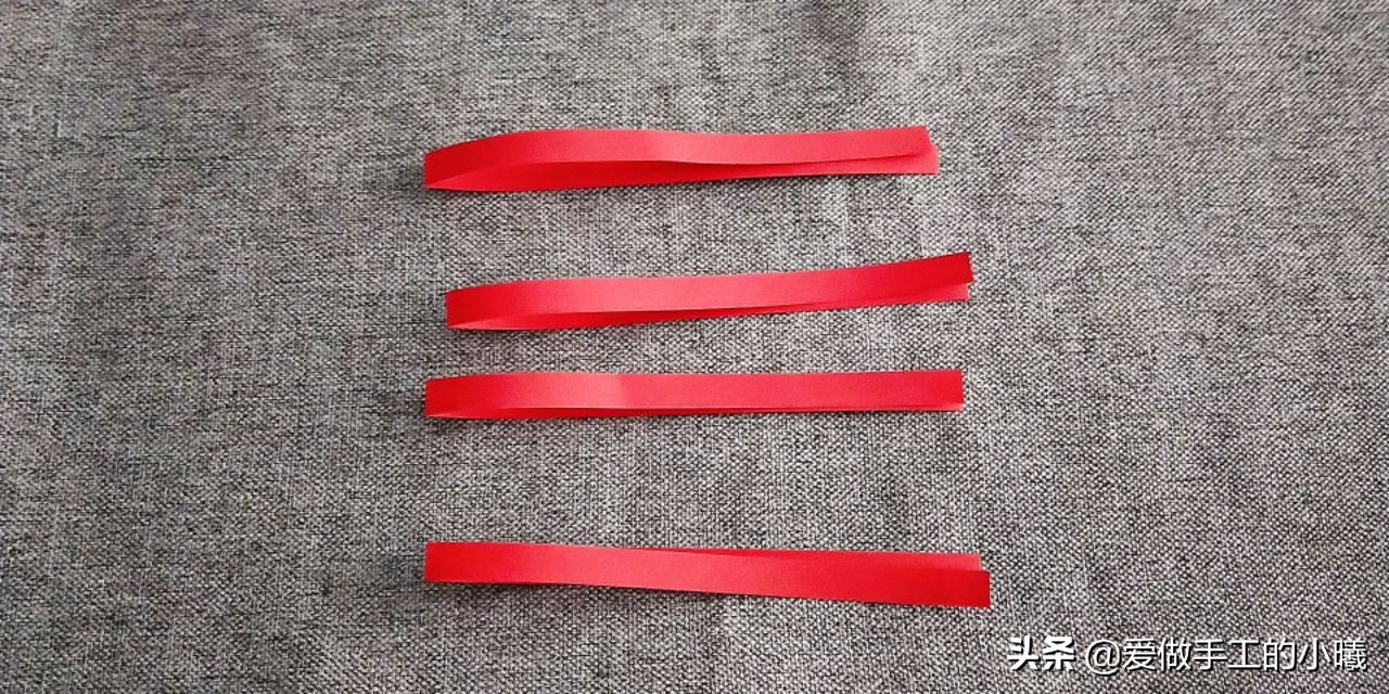 用纸条编织灯笼上面的穗子教程,用折星星的纸条做灯笼